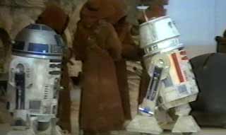 R2-D2 watches the sale of R5-D4 in Episode IV