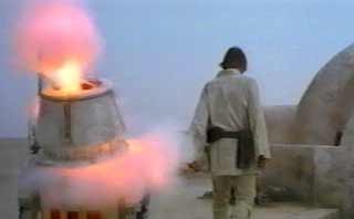 R2-D2 rubs out R5-D4 at the Lars-Skywalker Homestead in Episode IV